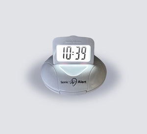 A white Sonic Alert personal alarm clock with a digital LED display showing 10:39, set against a plain light gray background.